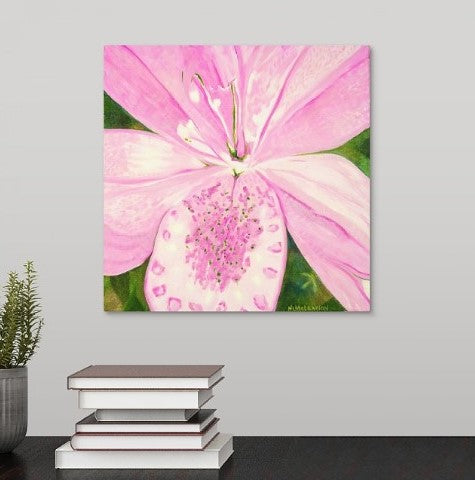 A painting, by fine artist Nancy McLennon, of light pink lily in a green garden background hanging over a desk