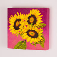 a painting by fine artist Nancy McLennon of a trio of yellow sunflowers and leaves on a fuchsia background sideview 