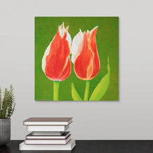 Load image into Gallery viewer, A painting of two sunlit orange tulips in full bloom with solid, vivid green  backdrop hanging over a black desk