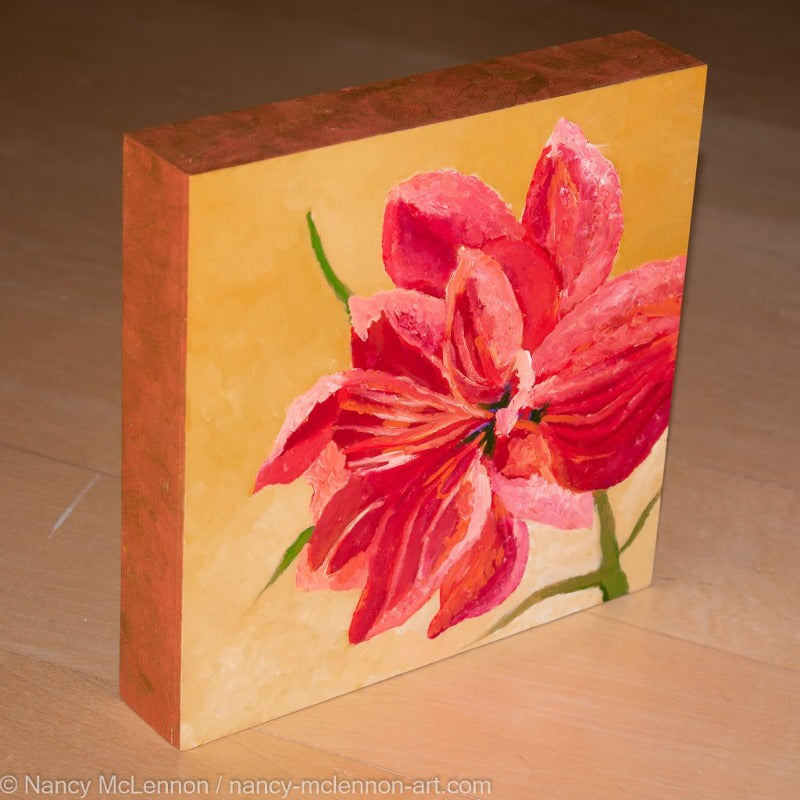 A side view of a painting by fine artist Nancy McLennon, of a single Red Barbados Amaryllis bloom on yellow ombre background