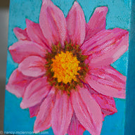 a painting by fine artist Nancy McLennon of a pink gerber daisy with yellow core in full bloom on sky blue background detail