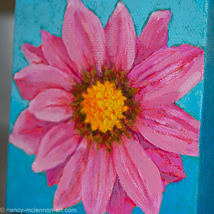 a painting by fine artist Nancy McLennon of a pink gerber daisy with yellow core in full bloom on sky blue background detail