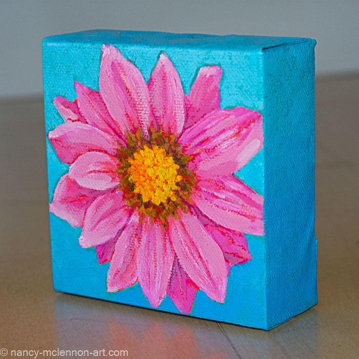 a painting by fine artist Nancy McLennon of a pink gerber daisy with yellow core in full bloom on sky blue background sideview