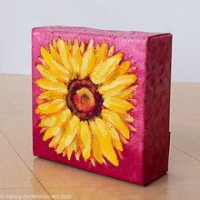 Load image into Gallery viewer, a painting by fine artist Nancy McLennon of a yellow sunflower with a brown center on ombre magenta background sideview