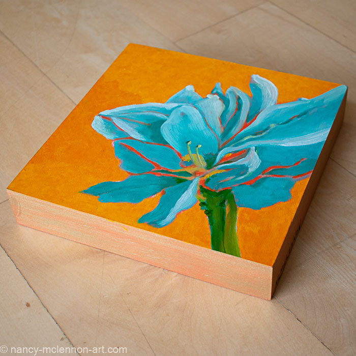 a painting by fine artist Nancy McLennon of a teal amaryllis on a yellow background overview