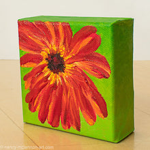 Load image into Gallery viewer, a painting by fine artist Nancy McLennon of a red gerber daisy with a brown center on a bright green background sideview