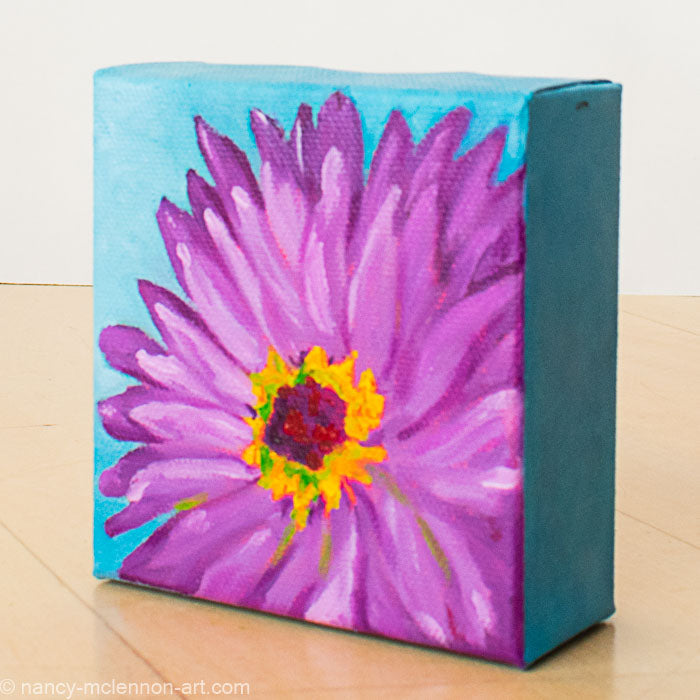a painting by fine artist Nancy McLennon of a purple gerber daisy with a yellow and brown center on a blue background side view
