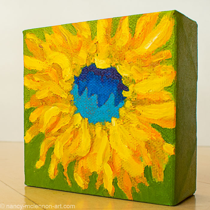 a painting by fine artist Nancy McLennon of a yellow sunflower with blue center on a bright green background sideview