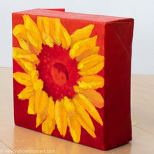 Load image into Gallery viewer, a painting by fine artist Nancy McLennon of a yellow sunflower with a red center on a red ombre background sideview
