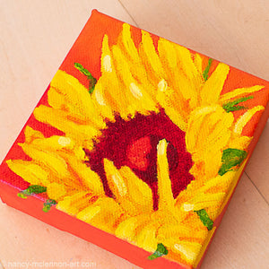 a painting by fine artist Nancy McLennon of a yellow sunflower with a red center on an orange background overview