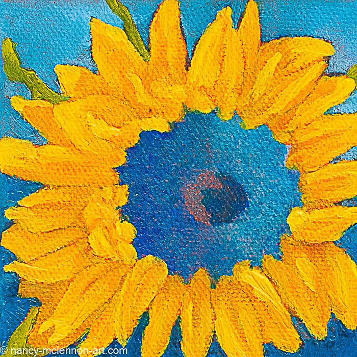 a painting by fine artist Nancy McLennon of a yellow sunflower with a blue center on dark blue background
