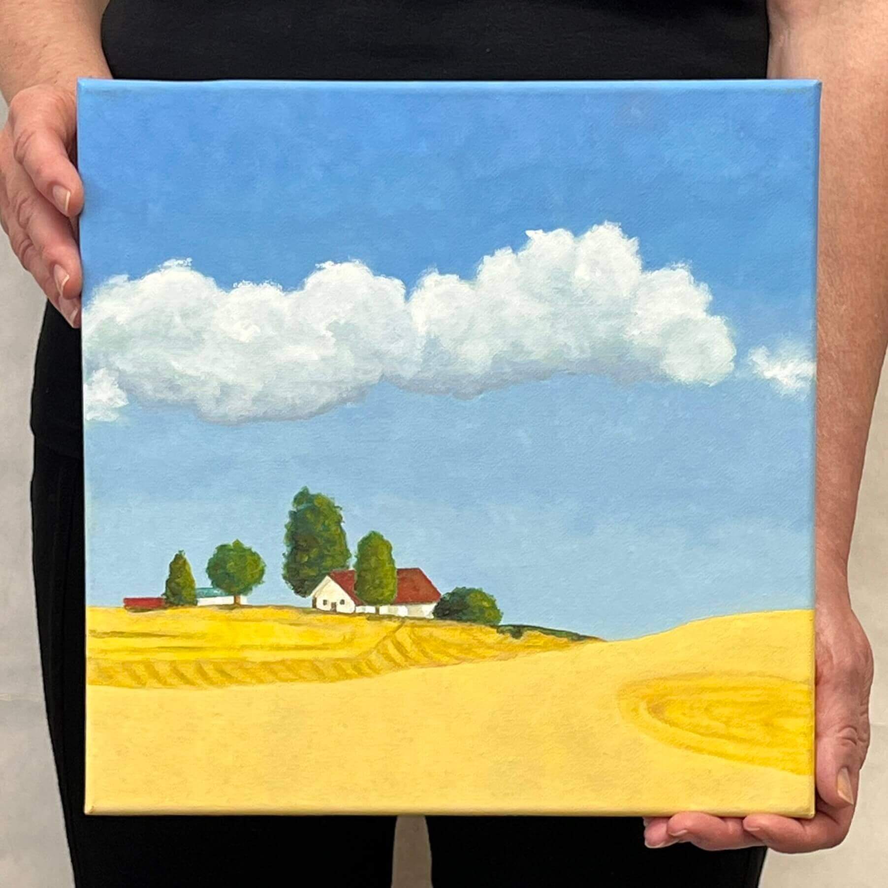 A painting, by fine artist, Nancy McLennon of golden farm fields near Spokane, little red-roofed farmhouse, a clear blue sky with fluffy white clouds 