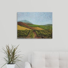 Load image into Gallery viewer, A painting of green and golden, sunlit vineyard hillsides of Napa Valley, California in the fall over a white couch